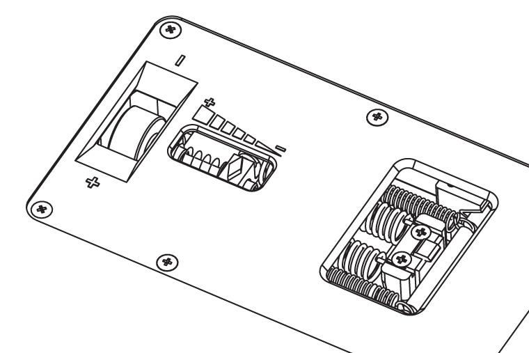 Here the back cover plate is in place. Open slots reveal a spring 